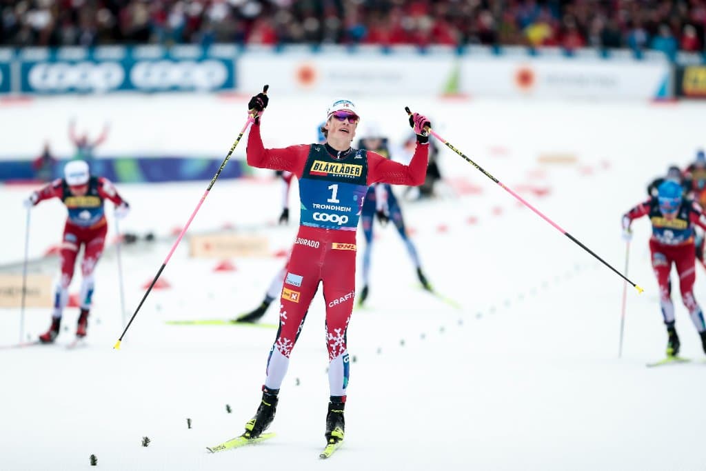 A World Cup cross-country skier racing in the leader's bib